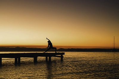 Sunset yoga on the pier at Thatch Caye Resort _ Belize Retreats